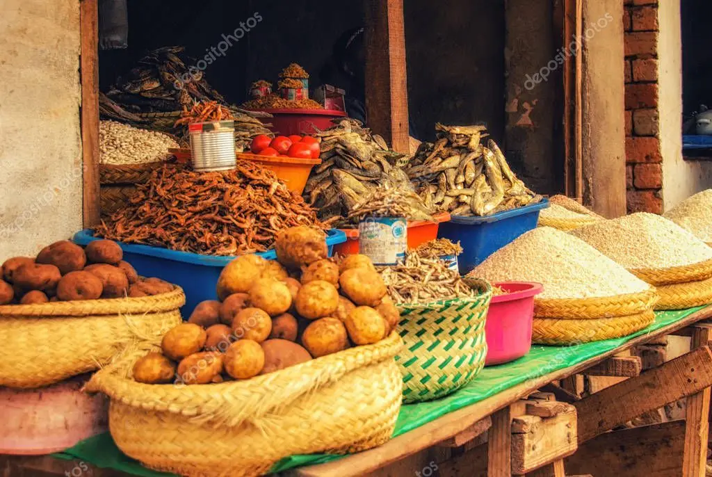 Busy open-air market with traders and shoppers